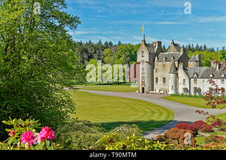 BALLINDALLOCH CASTLE BANFFSHIRE SCOTLAND THE  GARDENS WITH COLOURFUL RED RHODODENDRON FLOWERS Stock Photo