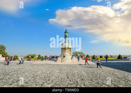 Tourists near the equestrian statue of Prince Savoyai Eugen on the terrace in front of the Royal Palace at the Buda Castle Complex in Budapest Hungary Stock Photo