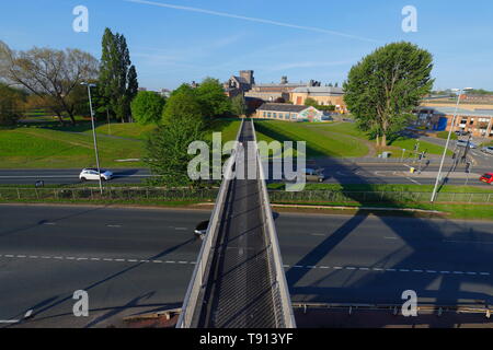 A footbridge over Canal Street that leads to HMP Armley. Stock Photo