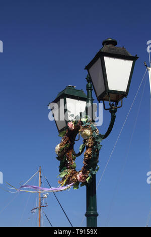 Vourkari Kea Island Greece Floral Wreath Hanging on Street Lights Stock Photo