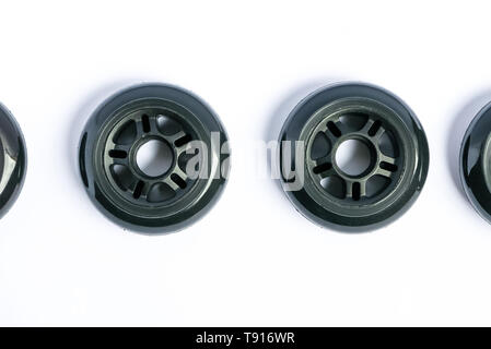 Inline skate wheels, two rollerblade wheels isolated on white background Stock Photo