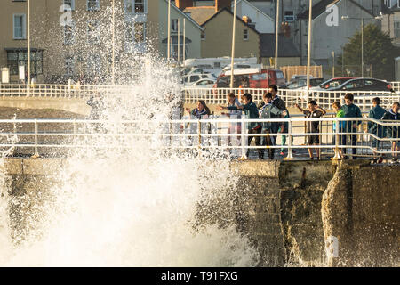 Aberystwyth Wales UK, Wednesday 15 May 2019 UK Weather: A group of scouts getting splashed by the waves in Aberystwyth, on a bright, sunny and very warm May evening, as the spell of high pressure continues to dominate the weather over the UK photo Credit: keith morris/Alamy Live News Stock Photo