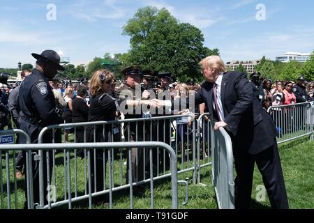 Washington DC, USA. 15th May, 2019. U.S President Donald Trump greets guests at the 38th Annual National Peace Officers Memorial Service on the West Lawn of the U.S. Capitol Building May 15, 2019 in Washington, DC. Credit: Planetpix/Alamy Live News Stock Photo