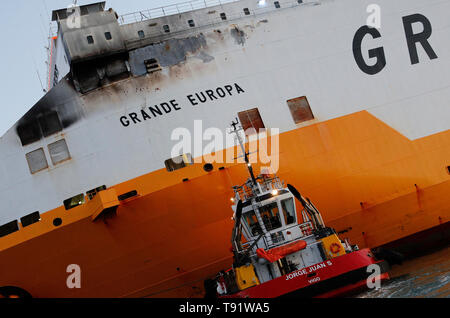 Palma, Spain. 16th May, 2019. The cargo ship 'Grande Europa' of the Italian company 'Grimaldi Lines' burned down yesterday near Mallorca when it was traveling from Sardinia to Valencia loaded with 1,843 cars. The crew was rescued and the ship was towed to the port of Palma without any incidents Credit: Clara Margais/dpa/Alamy Live News Stock Photo