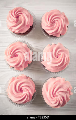Sweet cupcakes on light background Stock Photo