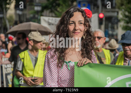 In the picture a girl with typical dress of San Iisdro Holliday in Madrid. 8 years celebration of the political project in Madrid 15 m, the people of  Stock Photo