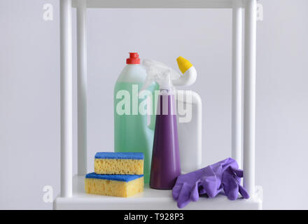 https://l450v.alamy.com/450v/t928p3/cleaning-supplies-on-shelving-against-light-background-t928p3.jpg