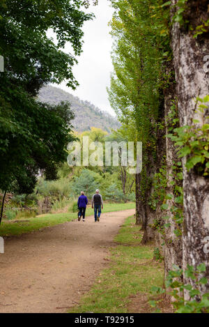 Senior couple walking along country path in Bright  Victoria Australia Stock Photo