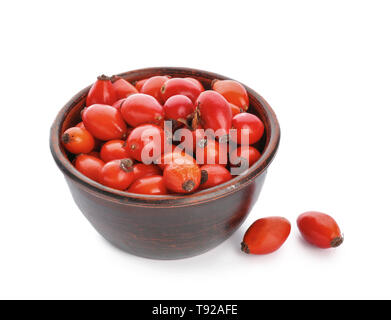 Bowl with rose hips on white background Stock Photo