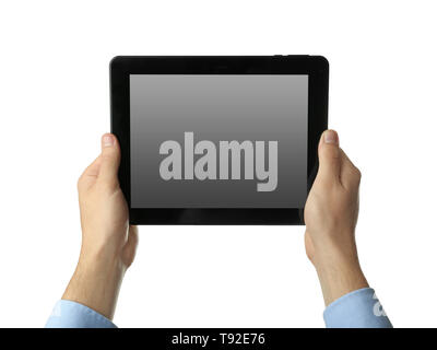 Young businessman holding tablet PC on white background Stock Photo