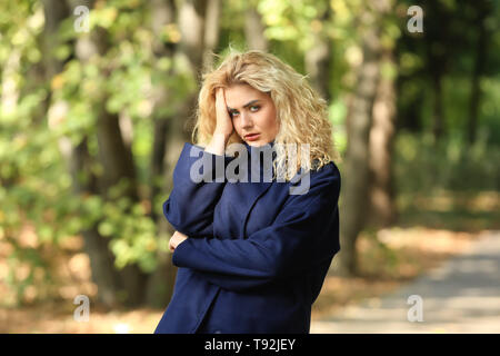 Abused young woman outdoors Stock Photo