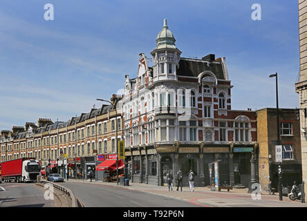 The New Cross pub and high street shops along on the A2 New Cross Road, Lewisham, South London. Ornate Victorian architecture. Stock Photo