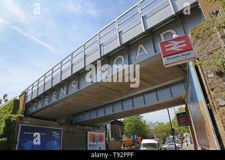 The railway bridge at Queens Road station in Peckham, southeast London. The latest part of this once poor area to become trendy and fashionable. Stock Photo