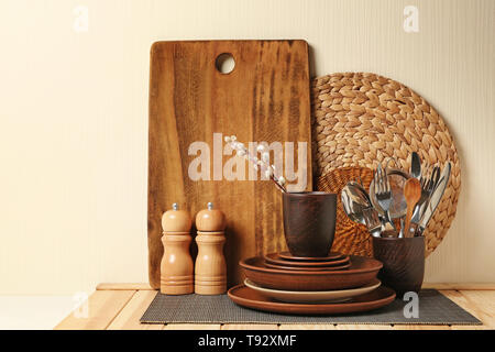 Set of clean dishware on wooden table Stock Photo