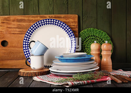 Set of clean dishware on wooden table Stock Photo