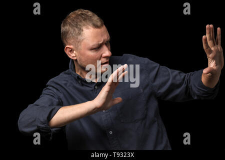 Man having panic attack on dark background Stock Photo