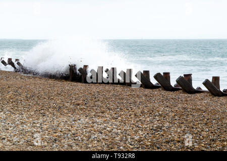 Waves crashing over the sea defences, Hayling Island, Hampshire, UK Stock Photo