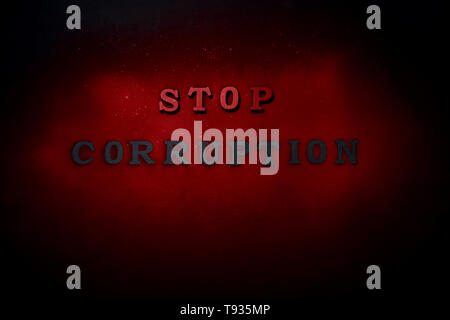 Text STOP CORRUPTION on dark background Stock Photo