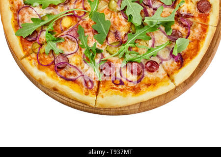 Delicious pizza with sausages mozzarella sauce cucumber and onions on a wooden board on an isolated white background Stock Photo