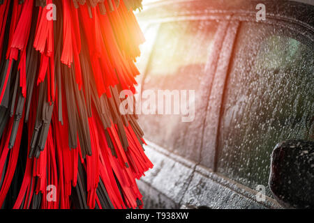 Automatic car wash in action. Car wash concept. Automated technology Stock Photo