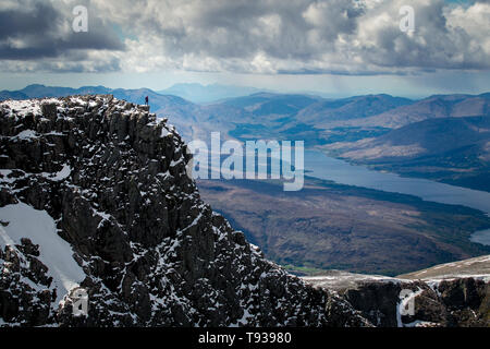 Climber on cliff edge of north face on Ben Nevis, Scotland. Stock Photo