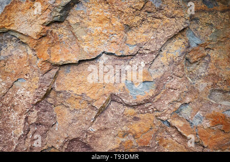 Close up picture of a rock surface, natural background or texture. Stock Photo