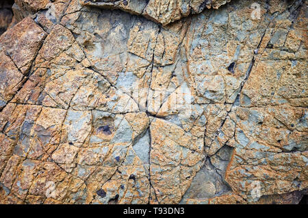 Close up picture of a rock surface, natural background or texture. Stock Photo