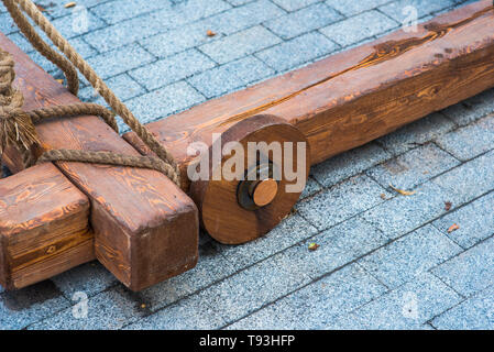 ancient catapult on the ramparts of Alghero ,Sardinia Island, Italy , Defensive wall. Catapult in the downtown of the citywith the sea as background a Stock Photo