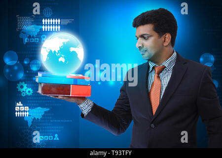 Business man with books and globe Stock Photo