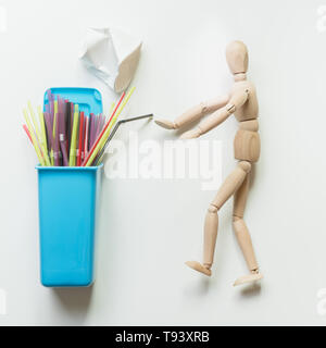 Containers for separate collection garbage with plastic straw. Top view. Concept save planet. Stock Photo