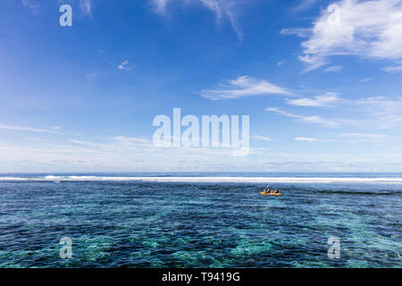 Family doing watersport kayak in clear pacific ocean water in the reef on a tropical island, Samoa, Polynesia. Stock Photo