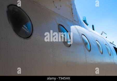 Fuselage cabin. Part of the aircraft. The body of the aircraft against the blue sky. Stock Photo