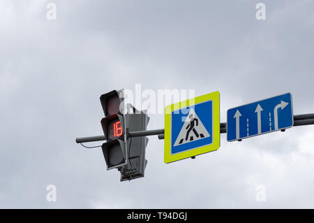 Red color at the traffic lights. Sign of the pedestrian crossing. Road signs turning. Stoplight on red Stock Photo