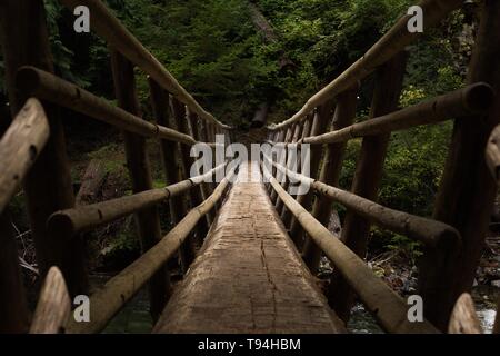 Point of view perspective on a suspension bridge Stock Photo