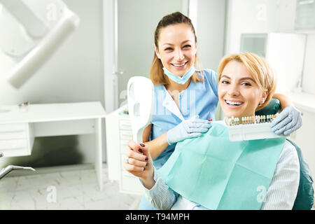 Female dentist working with a patient girl Stock Photo
