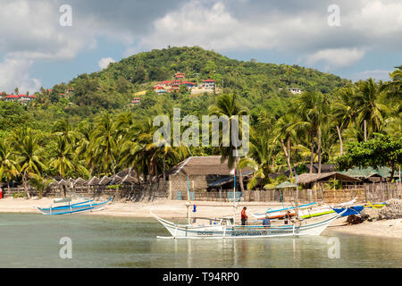 Boats at Anilao beach and pier, Batangas, Philippines Stock Photo