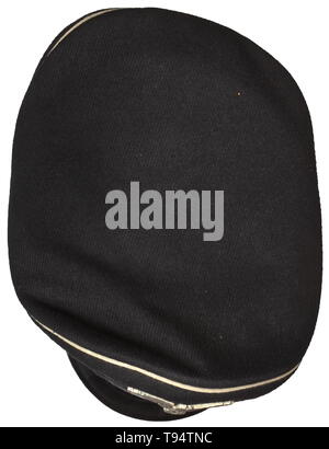 A visor cap for enlisted men/NCOs of the Allgemeine-SS regulation issue Black cloth, black trim band, white piping, beige silk liner, beneath the cap trapezoid large gold-stamped runes and size designation '56', beneath the brown leather sweatband an SS/RZM tag, the inside of the sweatband with handwritten wearer's identification 'Steiner Hans', the underside of the visor with the ink stamping 'RZM SS', silvered non-ferrous metal insignia, black patent leather straps. A lightly used visor cap. historic, historical, 20th century, Editorial-Use-Only Stock Photo