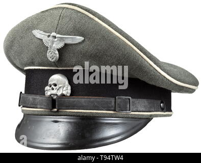 A visor cap for enlisted men/NCOs of the Waffen-SS late example made from looted Italian cloth Made of Italian gabardine (typical for the later Waffen-SS uniform). Trim band of black cloth, white piping, inner liner of Italian herringbone, cap trapezoid, frayed sweatband of replacement material, the visor of vulcanised fibre, patent leather straps (typical SS model), aluminium insignia. historic, historical, 20th century, 1930s, 1940s, Waffen-SS, armed division of the SS, armed service, armed services, NS, National Socialism, Nazism, Third Reich, German Reich, Germany, mili, Editorial-Use-Only Stock Photo