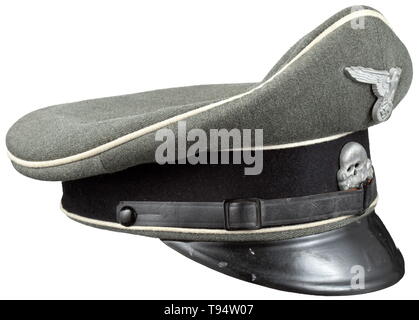 A visor cap for enlisted men/NCOs of the Waffen-SS late example made from looted Italian cloth Made of Italian gabardine (typical for the later Waffen-SS uniform). Trim band of black cloth, white piping, inner liner of Italian herringbone, cap trapezoid, frayed sweatband of replacement material, the visor of vulcanised fibre, patent leather straps (typical SS model), aluminium insignia. historic, historical, 20th century, 1930s, 1940s, Waffen-SS, armed division of the SS, armed service, armed services, NS, National Socialism, Nazism, Third Reich, German Reich, Germany, mili, Editorial-Use-Only Stock Photo