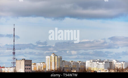 Panoramic view of new residential district with high-rise buildings and television antenna under blue sky with clouds of European visa-free city of Gr Stock Photo