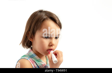 closeup portrait of the little girl with lipstick Stock Photo