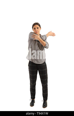 Young businesswoman isolated on white background doing exercises Stock Photo