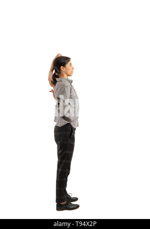 Young businesswoman isolated on white background doing exercises Stock Photo
