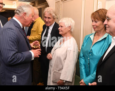 The Prince of Wales talks with Dame Judi Dench and her partner David Mills, watched by Celia Imrie at the annual Fortnum & Mason Food and Drink Awards at Fortnum & Mason, central London. Stock Photo