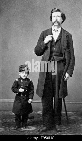 Entitled: 'General Grant, Jr. The smallest man living, 13 years old, 23 inches high, and weighs 18 1/2 pounds, as he appeared at Barnum's Museum, New York' standing next to an unidentified man. Edmund Newell (July 27, 1857 - December 23, 1915), better known as General Grant Jr. or Major Edward Newell, was a 19th century dwarf from Chicago who gained fame as an associate of P. T. Barnum. Edmund married Minnie Warren in 1877. Stock Photo