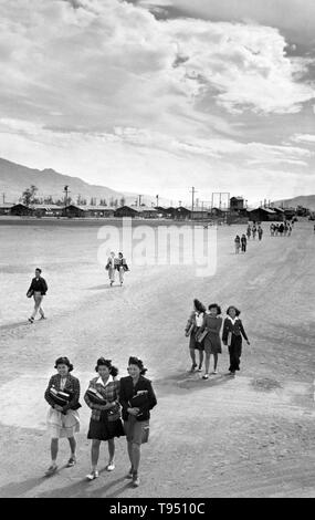 Entitled: 'School children, Manzanar Relocation Center, California.' The internment of Japanese-Americans during WWII was the forced relocation and incarceration in camps of 110,000-120,000 people of Japanese ancestry (62% of the internees were US citizens) ordered by President Roosevelt shortly after Japan's attack on Pearl Harbor. Japanese-Americans were incarcerated based on local population concentrations and regional politics. Stock Photo