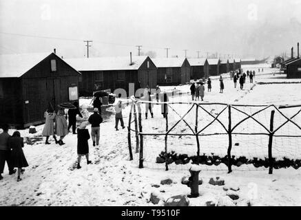 Entitled: 'People leaving Buddhist church, winter, Manzanar Relocation Center, California.' The internment of Japanese-Americans during WWII was the forced relocation and incarceration in camps of 110,000-120,000 people of Japanese ancestry (62% of the internees were US citizens) ordered by President Roosevelt shortly after Japan's attack on Pearl Harbor. Japanese-Americans were incarcerated based on local population concentrations and regional politics. Stock Photo