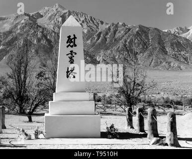 Entitled: 'Monument in cemetery, Manzanar Relocation Center, California. The internment of Japanese-Americans during WWII was the forced relocation and incarceration in camps of 110,000-120,000 people of Japanese ancestry (62% of the internees were US citizens) ordered by President Roosevelt shortly after Japan's attack on Pearl Harbor. Japanese-Americans were incarcerated based on local population concentrations and regional politics. Stock Photo