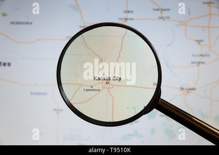 Kansas City, United States. Political map. The city on the monitor screen through a magnifying glass. Stock Photo