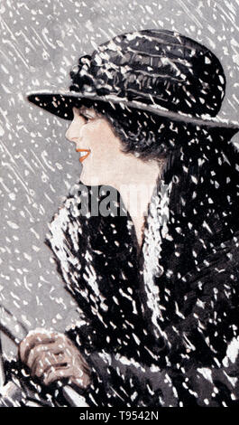 Entitled: 'A lady in a hat and fur-lined coat drives through the snow.' In the United States, 'Season's Greetings' and 'Happy Holidays' have become a common holiday greeting in the public sphere of department stores, public schools and greeting cards. Its use is generally confined to the period between Thanksgiving and New Year's Day. Stock Photo